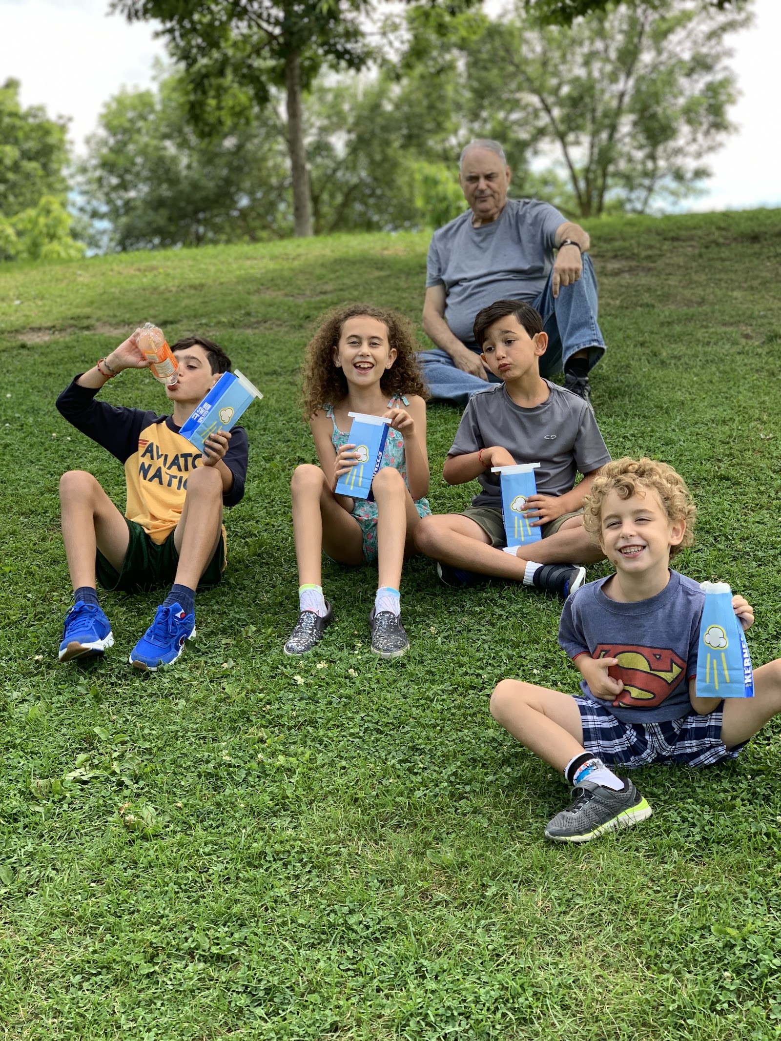 Morris outdoors with his grandchildren