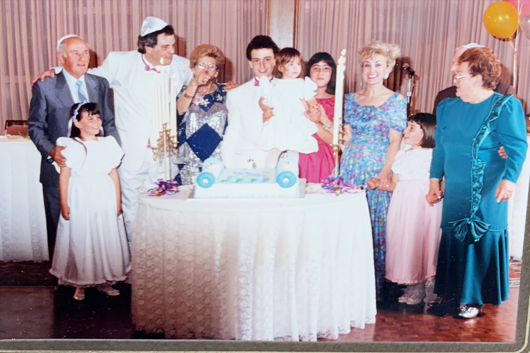 Several generations gathered around a celebration table