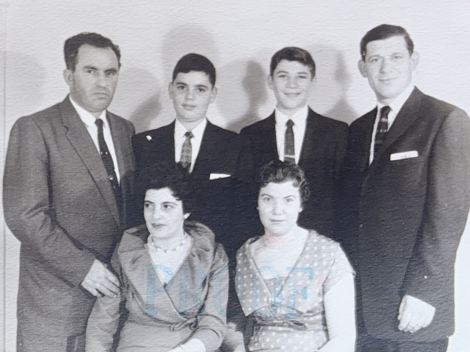 A formal family portrait with Morris as a teenager