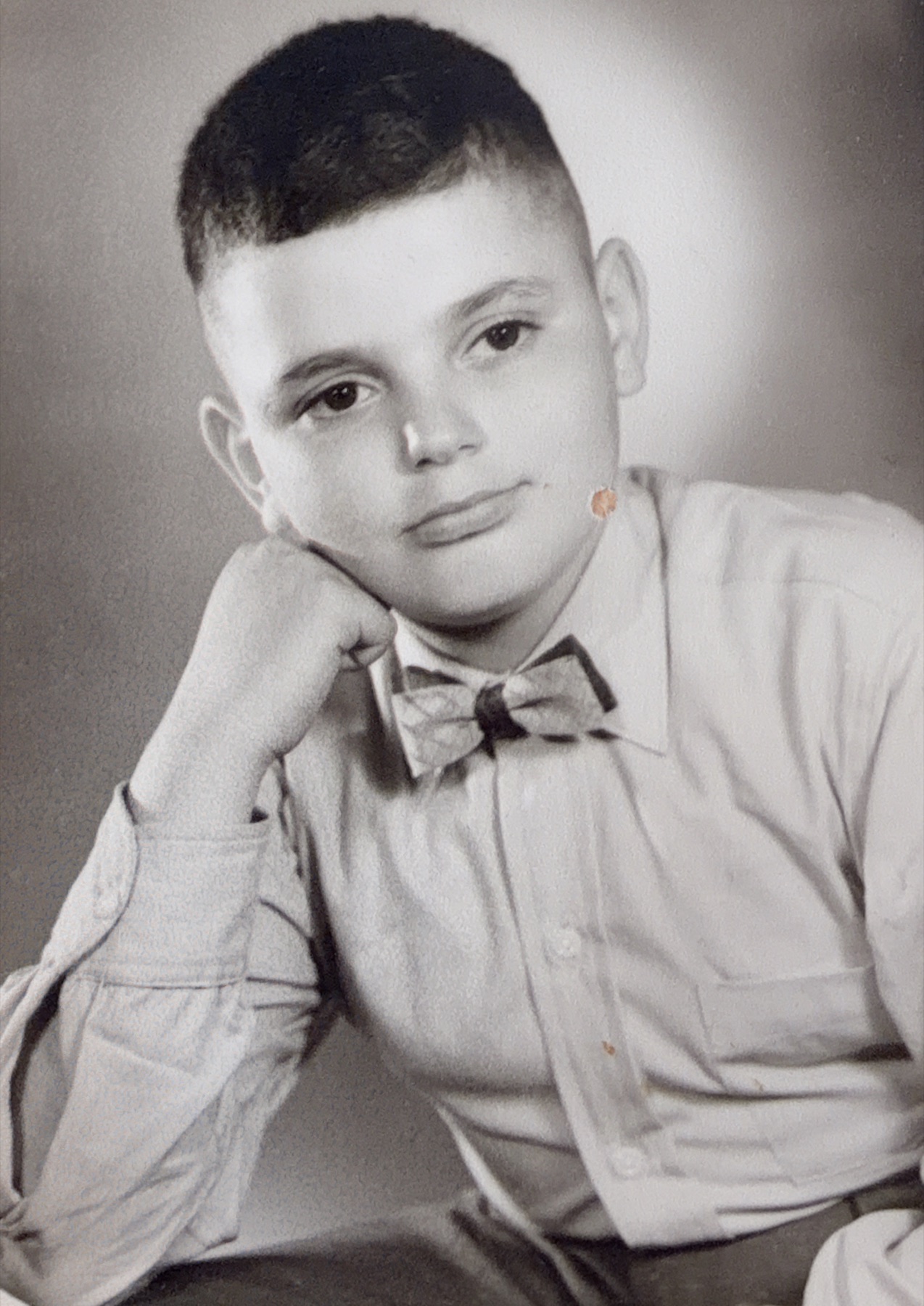 A school portrait of Morris wearing a bow tie