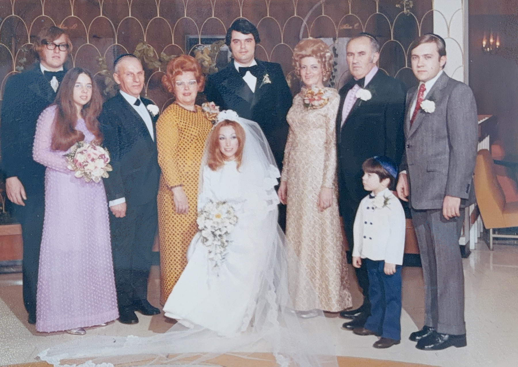 The extended family gathered around the newlyweds