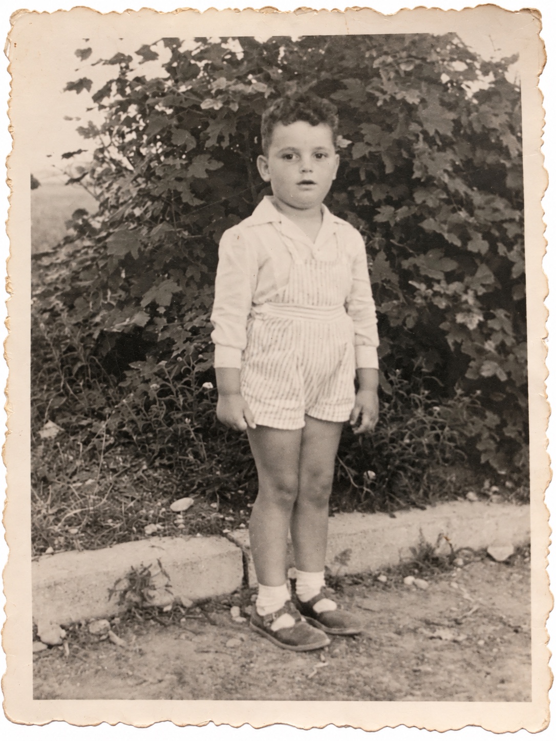 Morris as a young boy standing outside